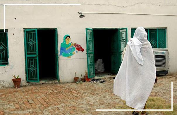 A woman enters the Potohar Organization for Development Advocacy artisan center in Chakwal, Pakistan